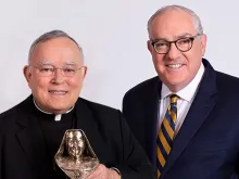 Archbishop Charles J. Chaput receives first annual Mother Angelica Award from EWTN CEO Michael P. Warsaw.
